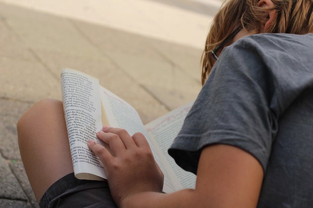 Little boy reading a book