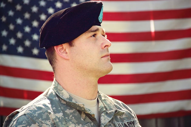 Soldier with American flag in the background